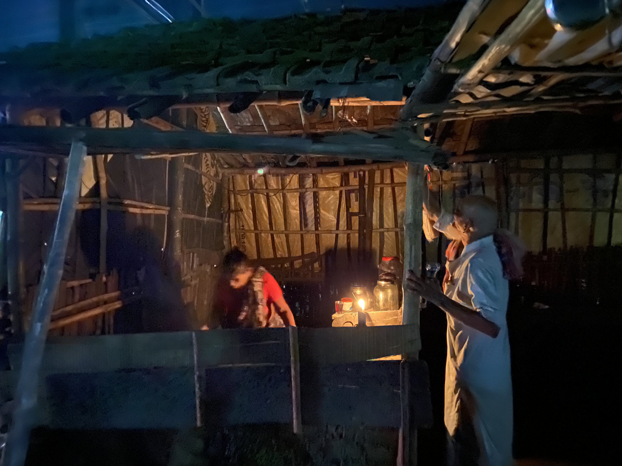 Solo travel scenes - old man and woman at tea stall, during a power cut