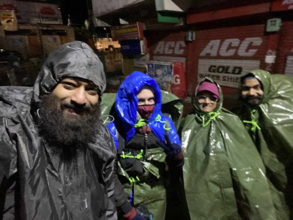 Shairik Sengupta and friends in makeshift rain coats