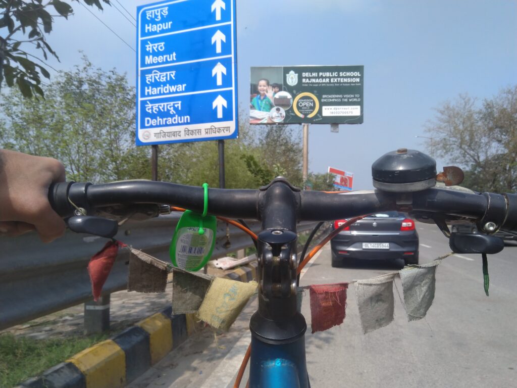 Cycle and Tibetan Buddhist prayer flags